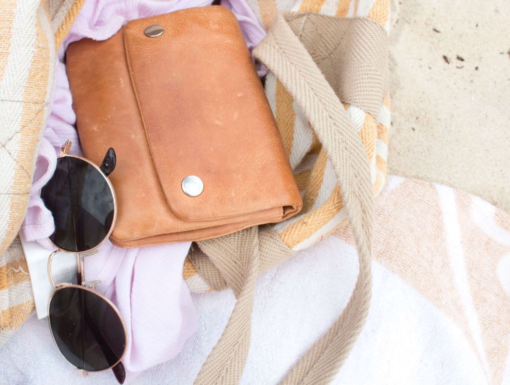 A freelancer digital marketer's bag on the beach